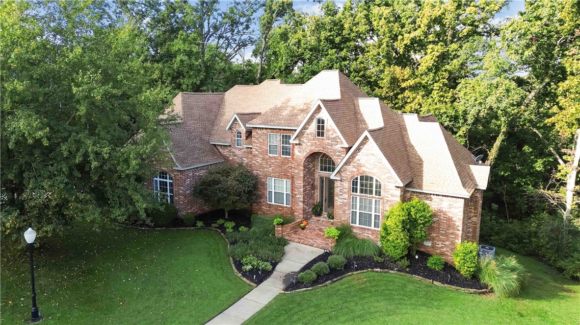 Classic Bentonville Home. Lifestyle & Location. Discover timeless elegance at 219 Ridgefield in Bentonville’s Hanover neighborhood. With 5,579 sq ft of living space, this home offers a perfect blend of tradition and comfort. From spacious living and dining areas to inviting rooms designed for gathering, every detail reflects quality and charm. The luxurious primary suite provides a relaxing retreat, while the home’s thoughtful layout offers space for both everyday living and entertaining. All just minutes from trails, parks, schools, and the vibrant heart of Bentonville—this is truly a classic home in a classic neighborhood.