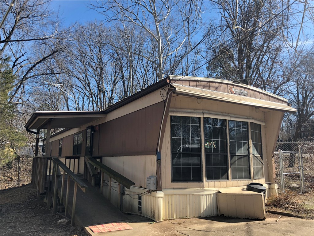 Well maintained, very clean 2 bedrooms, 1 bath mobile home. Handicap accessible. Lot of cabinet space, sunroom, eat-in-kitchen, new floors, new roof 2015, and all appliances included. Storage shed on lot, chain link fenced area. Central heat & air.