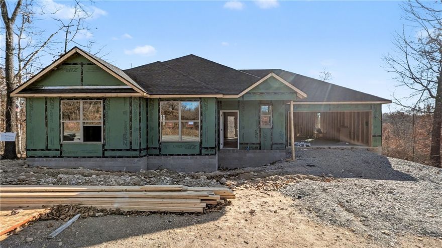 Welcome To Your Next Home! This Fresh New Build Brings The Perfect Combo Of Style, Space, And “Let’s Live A Little.” Tucked In A Prime Spot With Mountain Bike Trails All Around You, This One Delivers Instant Lifestyle Upgrade. Bentonville Schools. Step Inside To A Bright, Open Layout Featuring A Vaulted Living Area, Statement Beams, Cozy Fireplace, And A Kitchen Built To Impress—Custom Cabinets, Quartz Counters, Tile Backsplash, Island Seating, And A Walk-In Pantry Big Enough To Celebrate. The Primary Suite Is Your Daily Retreat With A Full Custom Tile Shower, Dual Vanity, And A Closet Ready For Real-Life Storage. Secondary Bedrooms Offer Flex For Guests, Office, Or Gear Overflow. Kick Back On The Covered Back Deck Overlooking A Wooded, Peaceful Backyard—Your New Favorite Spot For Morning Coffee Or Post-Ride Chill. Loaded With Quality Upgrades, Smart Design, And All The Feels. This One Hits Different! Still Time To Make Interior Selections.