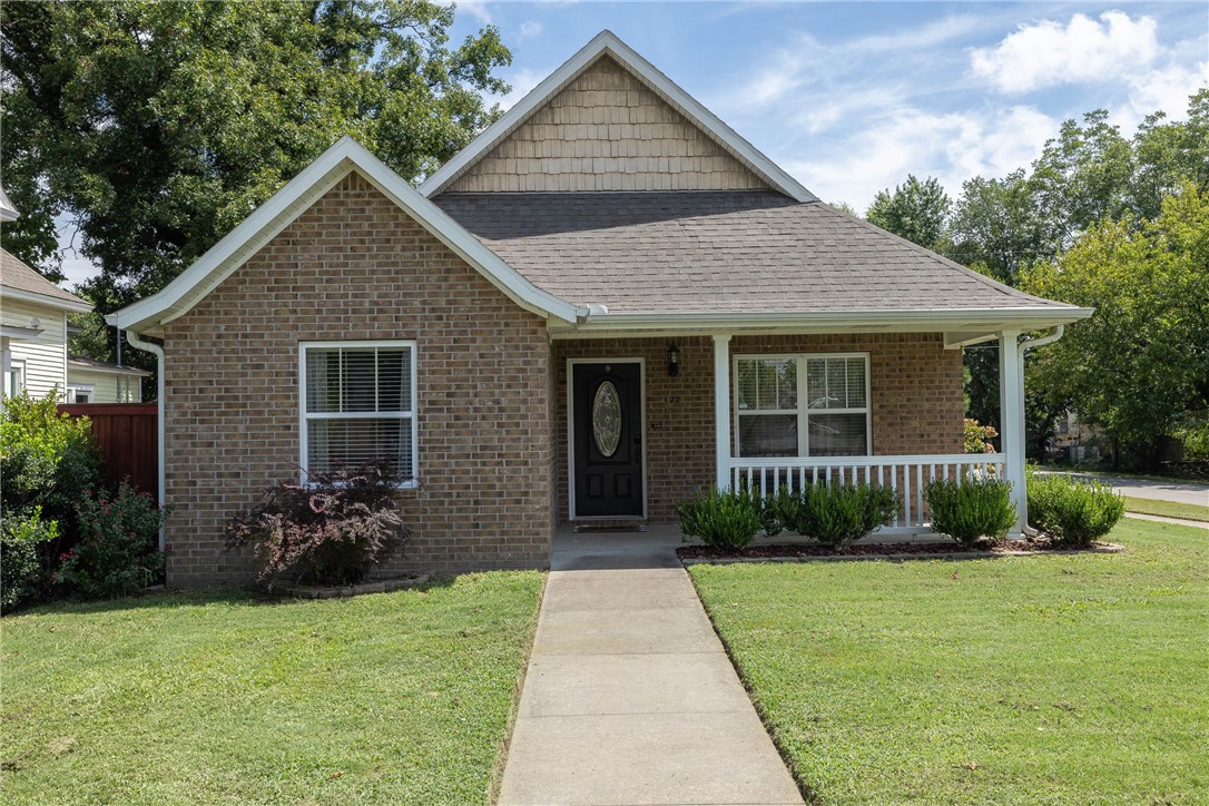 A short walk to Main Street, Gentry Intermediate School and City Park you will find this charming and pristinely kept 3 bedroom, 2 bath all brick home in downtown Gentry. Tile floors throughout showcase the well designed floorpan. The HUGE living room is open to the dining room and kitchen, and has a vaulted ceiling. Functional kitchen with new Whirlpool dishwasher and microwave, glass cooktop and two nice pantries. The large primary bedroom has natural light from the patio door to a covered porch, a walk-in closet and full sized bathroom. Outside, you will find a meticulous yard and landscaping surrounding the all brick detached 2-car garage, tool shed, and tall 2-car carport providing ample parking arrangements. Back yard is fully fenced and even has a domed window for the furry family to look out. Fresh paint and just a super clean home, inside and out.