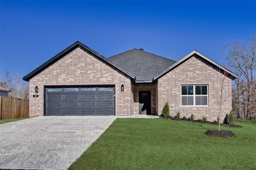 New construction on a flat .30 acre wooded lot located close to the Branchwood Nature Trail, Lake Loch Lomond boat launch, and Scotsdale Golf Course! Step inside to discover an inviting open concept design featuring 10’ ceilings and beautiful floors that enhance the spacious feel of the home. The stylish kitchen is equipped with premium black stainless steel appliances, a gas range, 3 cm quartz countertops, custom cabinets, and a walk-in pantry. Entertain or unwind in the living area, complete with a stunning fireplace, or step out onto the covered patio to enjoy the peaceful surroundings. The primary suite features a massive walk-in tile shower and closet. 2 bedrooms + office. Buyer can receive $3,500 in closing costs when using the builder's preferred lender!