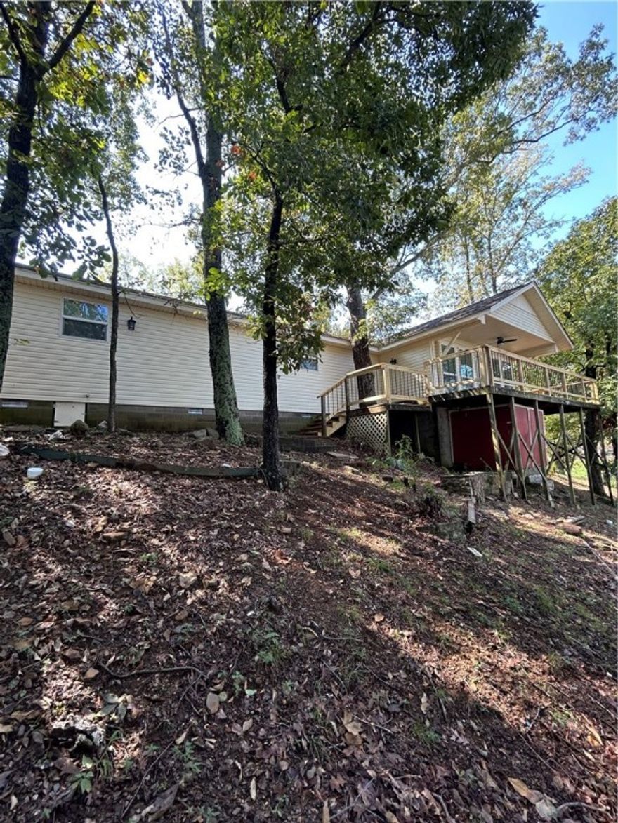 Beautiful lakefront home located in the peaceful Adams Lake Loop community of Conway. This charming residence features 2 bedrooms and 1 bathroom, with spacious living areas and an open floor plan. The updated kitchen includes modern appliances. Enjoy outdoor living on the wrap-around deck overlooking the water, perfect for relaxing or entertaining. Ideal for anyone seeking a serene waterfront retreat  in a friendly neighborhood with great Airbnb potential. Lake renovations project is under way by the  AGFC. With major improvements to aid with improved fishing, clear boating lanes, and greater vitality of Lake Conway. True Lakefront Properties in this condition do not come up on the market often. Don't let this trophy slip through your finger tips. Thanks for viewing.
