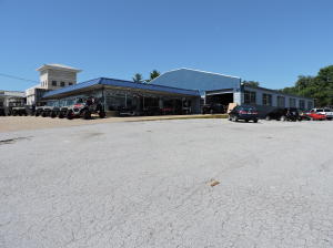 This Commercial Building is ideally located in downtown Harrison, Arkansas. The building has approximately 10,326 sq ft and sits on a 1+ acre lot on Main Street. High traffic count location and great visibility. Approximately 2500 sq ft of heated and cooled office space/show room. The remaining approximate 7800 sq ft is manufacturing/service/warehouse area which is heated with natural gas space heaters. Large fenced, secured, paved area in the back. Newer facade on front of building. A lot of building and land for this price!(PROPERTY ONLY, DOES NOT INCLUDE BUSINESS)