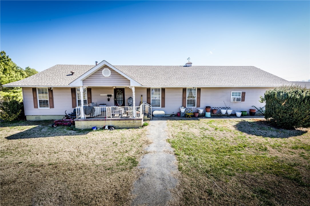 Home Sweet Home! Great 3BD/2BA home featuring open floor plan with windows galore overlooking 6.20 acres, Oak cabinets, large walnut trees, creek, fenced in yard, well insulated home, woodstove, storm shelter, attached 3 car carport, and four outbuildings/storage sheds. Home sits on beautiful partially open and wooded acreage. Don't miss this opportunity to call this home yours!