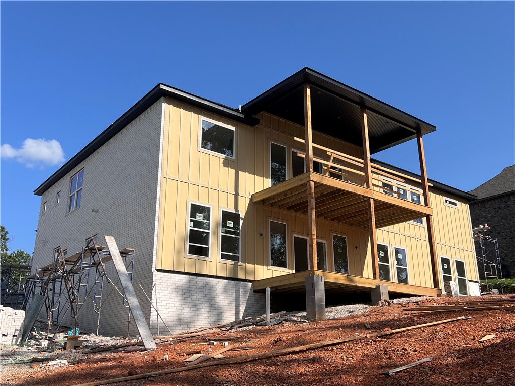 Stunning 5 bed, 5 bath home with approx. 4,025 SqFt and a 3-car garage featuring 13-ft ceilings and 8-ft tall doors. Includes 2 living areas, media room (pre-wired for projector & 7.2 surround), office, wet bar, and two 10x22 covered decks. Living room boasts 12-ft ceiling, electric fireplace, and accent wall. Formal dining room also features accent wall. Kitchen offers LG appliances, gas cooktop, vent-out hood, built-in microwave & oven, plus a coffee bar. Home is well-lit with 8-ft tall front door. Bathrooms include 2 standing showers and 3 tub/shower combos with 36” tubs, plus built-in storage. LVP flooring throughout with moisture barrier, stairs with wood posts and metal cables. Outdoor gas grill hookup. Spacious 100x100 backyard—plenty of room to entertain or relax!