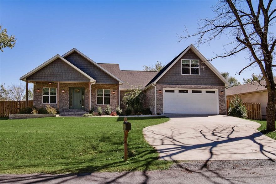Discover this stunning custom home, built in 2023, on a flat .56-acre lot, complete with a shadow box privacy fence and a large extended back deck. Plenty of space for a future inground pool! Enjoy solid core doors, a vented gas log fireplace, custom cabinets, wet bar, and an oversized 2 car garage. Office/dining room. The kitchen features a gas range, beautiful 3 cm quartz countertops, and floor-to-ceiling cabinets. Relax in the luxurious primary bath with a soaking tub and a large walk-in tile shower, plus an expansive primary closet that offers tons of space. 3 of the bedrooms are conveniently located on the main level. The upstairs 4th bedroom / full bath is oversized and can also double as a bonus room. Additional highlights include a 12x8 outdoor shed, refrigerator, and washer/dryer. Located less than 1 mile from the Tunnel Vision trail and just 5 minutes to the Lake Loch Lomond boat launch. Easy access to I-49. This home has it all! Schedule your showing today!