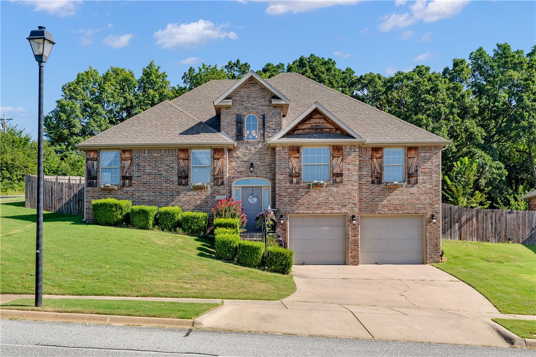 Sophisticated and beautifully maintained, this former model home offers timeless charm and modern functionality in a prime Fayetteville location. Situated on a landscaped corner lot, this all-brick home offers curb appeal and quality construction. Inside, vaulted ceilings and hardwood stair treads complement the open-concept layout, which includes a spacious living area, bright breakfast nook, and formal dining space. The oversized primary suite serves as a true retreat, complete with a walk-in closet and organizational shelving. Fresh interior paint enhances the bright and inviting atmosphere. Located directly along the Fayetteville bike trail and just minutes from schools, parks, and the bypass, this home offers a rare combination of privacy, beauty, and accessibility.