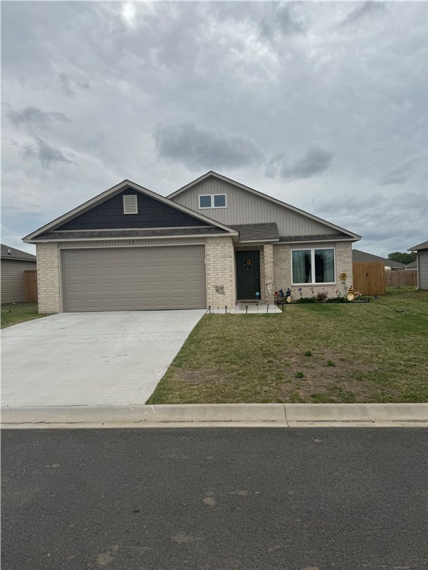 Welcome to this beautifully built 2025 home located in the desirable Oak Springs subdivision! This 3-bedroom, 2-bath home offers a modern layout with quality finishes throughout. The exterior features a classic blend of brick and vinyl siding for both style and low maintenance. Enjoy the privacy of a newly installed fence and relax on the cozy patio just off the kitchen—perfect for morning coffee or evening unwinding. Complete with a garage, this home is move-in ready and waiting for its new owners!