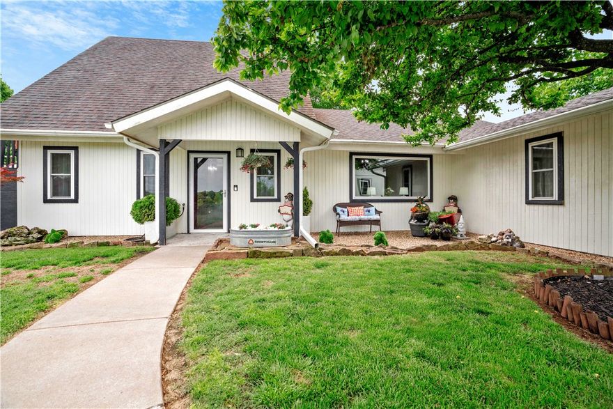 One-Owner home, with Million Dollar Views.  This is a custom built home that sits atop a beautiful hillside in West Fayetteville.  This 4-bedroom home gives you the sense you are in the country but the closeness of the City, it sits 10 minutes from the UofA.  It has a custom-built dog bed area under the stairs, with updates throughout the home.  It has a 3-car detached garage, with and workshop also available.  You can sit on the deck and enjoy the views while you have your cup of coffee.  The property is on the county line, with the front fence being the city limits.  Call me for a private showing.