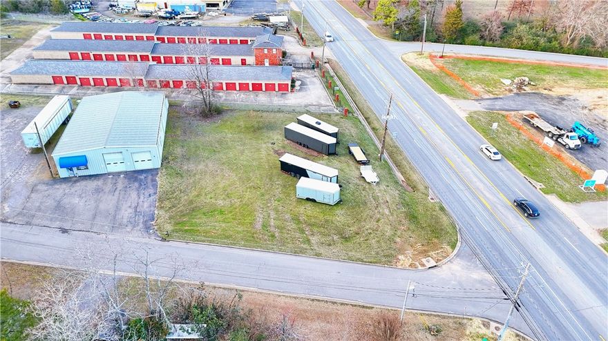 Prominently located C-2 zoned commercial parcel, situated on a high-traffic thoroughfare with approximately 20,000 vehicles passing daily, this property offers unparalleled visibility and exposure.  Strategic Zoning & Surroundings: - Zoned C-2 and surrounded by similarly zoned properties  Booming Area: - Located directly across from a future dentist, law office, and office/shopping center currently under construction  Scenic: - Close to the lake, charming neighborhoods, nearby the prettiest side of town. - Only 5 minutes from all essential amenities.  Convenience: - Approximately a mile from the Interstate 40 on/off ramp, offering easy access for customers and clients. Seize this unique chance to own a highly visible commercial lot in a growing area!