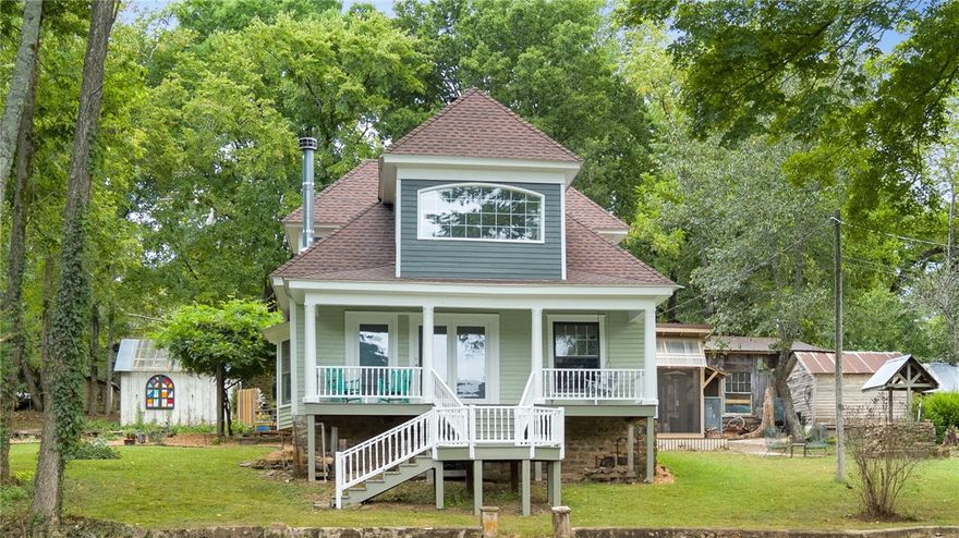 Tucked away on 4.32 private acres just outside Fayetteville, this one-of-a-kind property offers the perfect blend of charm, comfort, and outdoor living. The 2,305 sq. ft. home is rich with character, featuring pine tongue-and-groove flooring, restored wavy-glass windows, and inviting spaces throughout. Gather around the living room fireplace or enjoy the screened-in patio complete with its own fireplace and peaceful nature views. Radiant heated kitchen floors bring added comfort, while a queen Murphy bed creates flexible space for guests, work, or hobbies.

Step outside and enjoy wildlife from the front porch, explore the treehouse with zip line, or work on projects in the 1,000 sq. ft. wood shop with reclaimed details. Additional features include a rebuilt garage/carport, chicken house for up to 20 hens, waterfall feature, new 2025 roof, updated dormers, and a freshly regraded gravel driveway. A truly special retreat offering privacy, personality, room to breathe, and unforgettable outdoor living.