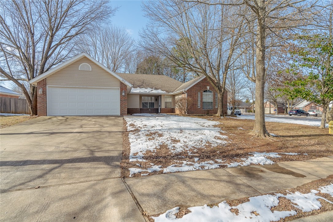 Discover this charming 4-bedroom, 2-bath home situated on a desirable corner lot with a fully fenced yard and surrounded by a serene, wooded lot, perfect for outdoor enjoyment. Step inside to find fresh paint and new carpet throughout, creating a clean and inviting atmosphere. The living room features a cozy fireplace, ideal for relaxing evenings. The spacious primary suite is a true retreat, boasting his-and-her closets in the bathroom. With its prime location near shopping centers and restaurants, this property offers both comfort and accessibility. Don't miss the opportunity to make this home yours!