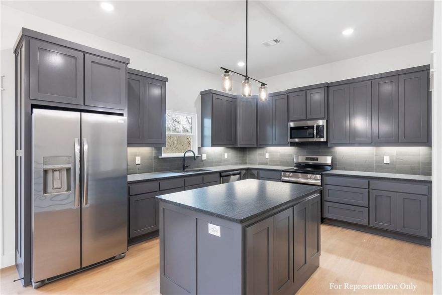 Welcome to where contemporary design, modern finishes, and luxury living come together. With its striking modern roofline and warm, welcoming interiors, the home is as stylish as it is functional. The main level features an open-concept living area, chef’s kitchen, and spacious primary suite. Downstairs, a walk-out basement reveals a large bonus room, two additional bedrooms, and a full bath—ideal for hosting guests or creating a second living space. Two covered decks overlook the wooded backyard. Located just minutes from Lake Windsor, the Little Sugar Trail System, and other west side amenities, this 2,045 sf, 3-bedroom, 2.5-bath residence offers comfort and connectivity in one of Bella Vista’s most scenic settings. This home includes quartz countertops, luxury LVP flooring, custom cabinetry, ample storage, and a hot water recirculating pump for added efficiency. A thoughtful blend of form and function—ready to welcome you home.
RD loan eligible for added financing flexibility.