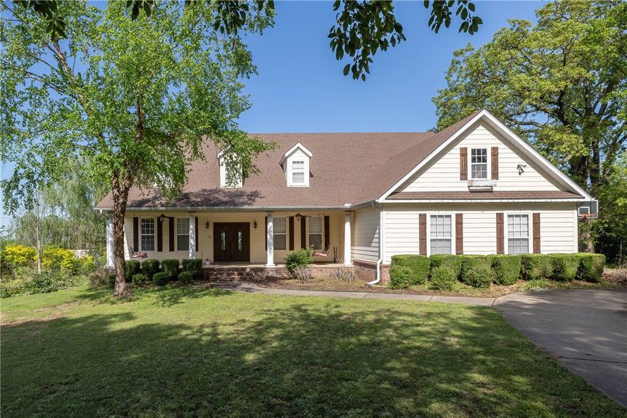 This stunning custom home is a true gem, offering numerous high-end features and finishes. The bamboo flooring throughout the first floor adds warmth and elegance to the space, while custom cabinets and built-ins showcase the home's attention to detail. The wood burning fireplace is the perfect spot to cozy up on chilly evenings, the five bedrooms provide ample space for rest and relaxation, and the formal dining room is ideal for hosting dinner parties. The outdoor space is truly exceptional with TREX decking installed in 2023, a gunite in-ground pool, sand volleyball court, irrigation system for flower beds, a shed, and RV parking. The property also boasts mature trees, a security system, and outdoor speakers at the pool, making it the perfect place to call home!