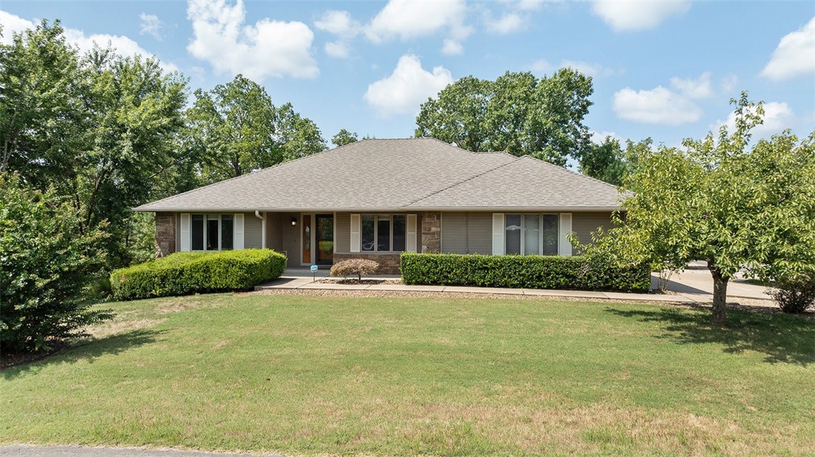 This beautifully updated home combines modern efficiency with inviting charm and a seasonal winter lake view. Equipped with a newer Lennox geothermal HVAC system and a Marathon water heater, the property offers comfort with long-term energy savings. The kitchen has been recently remodeled with quality finishes, while newer high-impact roof shingles add durability and peace of mind. The main level features a wood-burning fireplace tied into the heating system, and the lower level includes a pellet stove, creating multiple cozy gathering spaces. Outdoors, a rear garden area provides room for relaxing or cultivating fresh produce. An additional lot is also available (MLS #1321460) Approved borrowers will receive a closing cost credit of 1% of the loan amount up to $5,000 on their Closing Disclosure on their loan closing with Envoy Mortgage Branch NMLS #2659248 and Branch NMLS #2579798