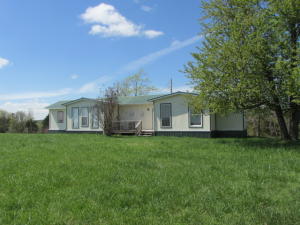 Spectacular View!! Nice home with a view that'll never get old. Interior has a cabin-like appearance with wood walls and ceilings throughout and a vaulted ceiling in living room and main bedroom. Baths are private to each bedroom. Nice deck to enjoy the view. 10x8 ft. storage shed. Must see.