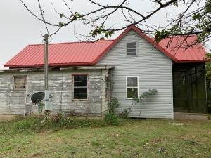 Bring your hammer and imagination!! Country farm home near the AR River and boat launch. Solid and preserved w/ a newer metal room, siding, and windows. Large kitchen w/ wood burning fireplace. Cute front covered screened-in porch. Original front door. Spacious attic adds opportunity to increase homes square footage. Large lot with outbuilding. Opportunity awaits!