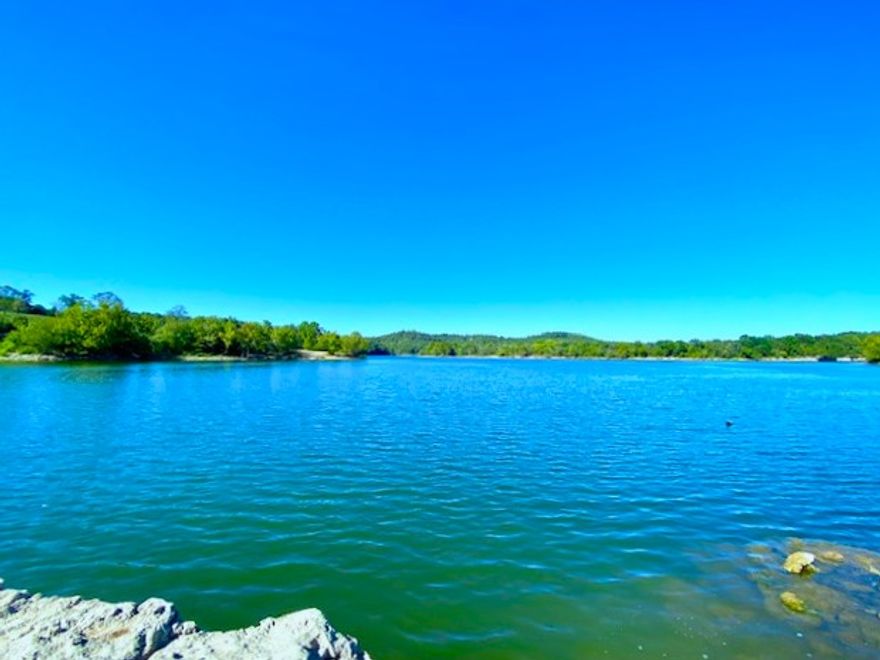 36 Acre Northwest Arkansas/Southwest Missouri Lakefront Estate 
Waterfront acreage featuring the elusive 'gentle-to-the-water' topography—ideal for a luxury lakeside manor, private family compound, or premium RV basecamp. Unlike steep cliffside lots, this near-level property offers easy lake access and premier building sites that are becoming impossible to find.
1,800 ft +/- Gentle Frontage: Easy walk-down access to Table Rock Lake.
Minutes from the State Boat Ramp and two full-service marinas by land or water.
Rural water and electric service on-site. 
1,800 ft +/- Highway 311 frontage.
3BR/2BA Residence, 40x50 Metal Shop/Garage,1900s heritage Barn. 
Big Cedar Lodge & Top of the Rock: 20 minutes to world-class dining, spa, golf and wilderness adventures.
Enjoy the "Quiet Side” of Table Rock Lake, secluded enough for total privacy, yet conveniently positioned as the gateway between Branson, Eureka Springs, and the booming Bentonville/Rogers area. 
Experience the scale, the history, and the water.