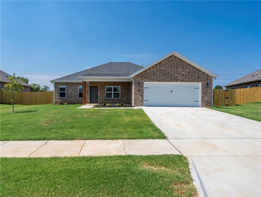 Beautiful 3 bedroom, 2 bath brick home in the Summerfield subdivision of Farmington! This home features an upgraded kitchen with white cabinetry, quartz countertops, stainless steel appliances, and a 5-burner gas range. Durable wood-look tile flows through the main living areas for easy maintenance and style. The spacious primary suite includes double vanities and a large tiled walk-in shower. Enjoy a fully fenced backyard. Located within walking distance to Creekside Park with playgrounds, walking trails, and pickleball courts. Conveniently near schools, shopping, and a short drive to all Fayetteville has to offer. Don't wait, this one won't last long!