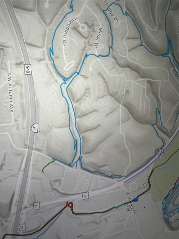 Large .35 acre lot in the area of the Bike Lift of SouthWest Bella Vista and Down Under Loop across the street! Bentonville Schools and less than 10 minutes from Downtown Bentonville, this large lot is exceptional! Trails in the immediate area: Down Under Loop, Little Sugar Trailhead, Down Under Connector to the Razorback Greenway and Wishing Springs Paved Trail, Vista, Little Sugar, Sick-a-More, Bella Vista Lake Trail and many more. Enjoy Recreational Resort-Style Living in its glory and in the Mt Bike Capital of the World!