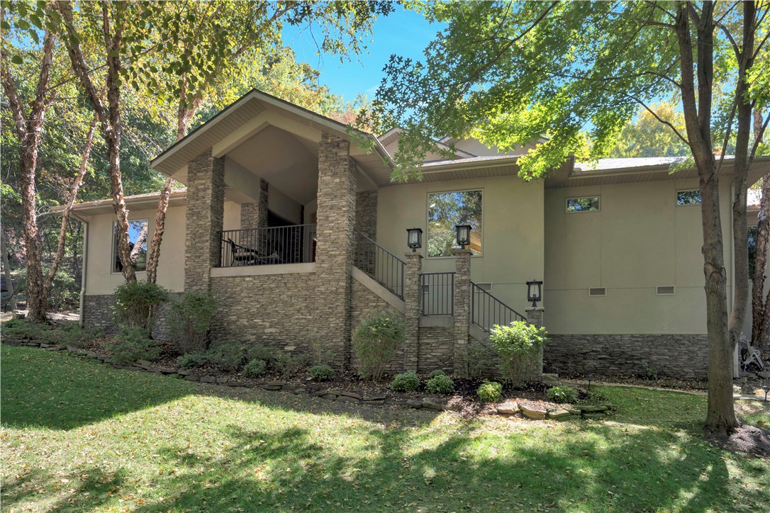 One of a kind, one owner, one level architecturally designed home in one of Fayetteville's 7 hillside communities. While in the middle of town and sitting on 1.35 acres, the property is surrounded by mature trees, wildlife and only 5 minutes to UofA. Beautifully designed home has an open floor plan, vaulted ceiling, wood flooring, and large windows with a view from the front & back. For entertaining, the deck extends the entire back of house that leads to a private walking trail to UofA. Don't miss this custom home in one of Fayetteville's most desirable neighborhoods.