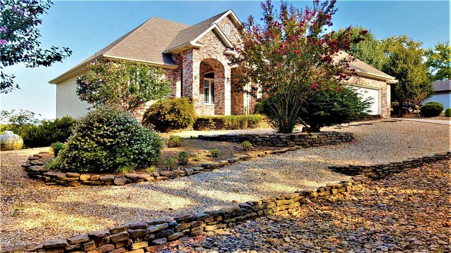 Opportunities to own a home in one of Bella Vista's most coveted neighborhoods doesn't come along very often, but here's your chance. Enjoy breathtaking views of Loch Lomond and take the tram to your private boat dock with electric lift for your boat and spend a relaxing day on the water. Inside you will find everything you would expect in a custom built home of this caliber. The spacious Kitchen offers plenty of cabinet/counter space with a center island with sink. It's open to the LR so that you never feel out of touch with friends and family. Generous room sizes ensure comfort without feeling crowded. There are 2 BR's on the main level + a study that is setup as a BR but doesn't have a closet. The lower level features a huge family room complete with kitchen, 3 more BR's, 2 more baths plus storage galore. The whole house generator removes the worry of being left in the dark during an outage. New roof in 2020. Take the Matterport virtual tour to explore this wonderful home. The dollhouse view shows the floorplan.