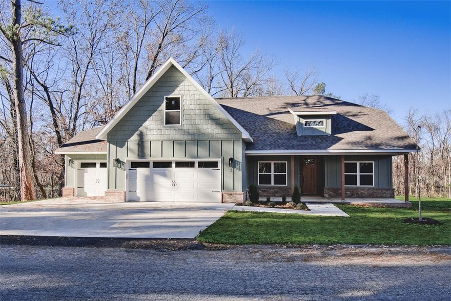 MOVE-IN READY! New construction on a .54 acre wooded lot! Located a few minutes from the Lake Loch Lomond boat launch, Highlands Golf Course, and I-49. Featuring a spacious 3-car garage, 3 bedrooms + upstairs bonus room with full bath. The kitchen is equipped with a large island, 3 cm quartz counters, custom cabinets, stainless steel appliances, and a gas range. The living room boasts a beautiful fireplace, exposed beams, a stunning cathedral ceiling, and hardwood floors which also extend into the primary bedroom. The primary bath features a luxurious soaking tub, separate vanities, and a huge walk-in closet with a custom tile shower. High-end finishes throughout. $3,500 in closing costs when using the builder's preferred local lender.