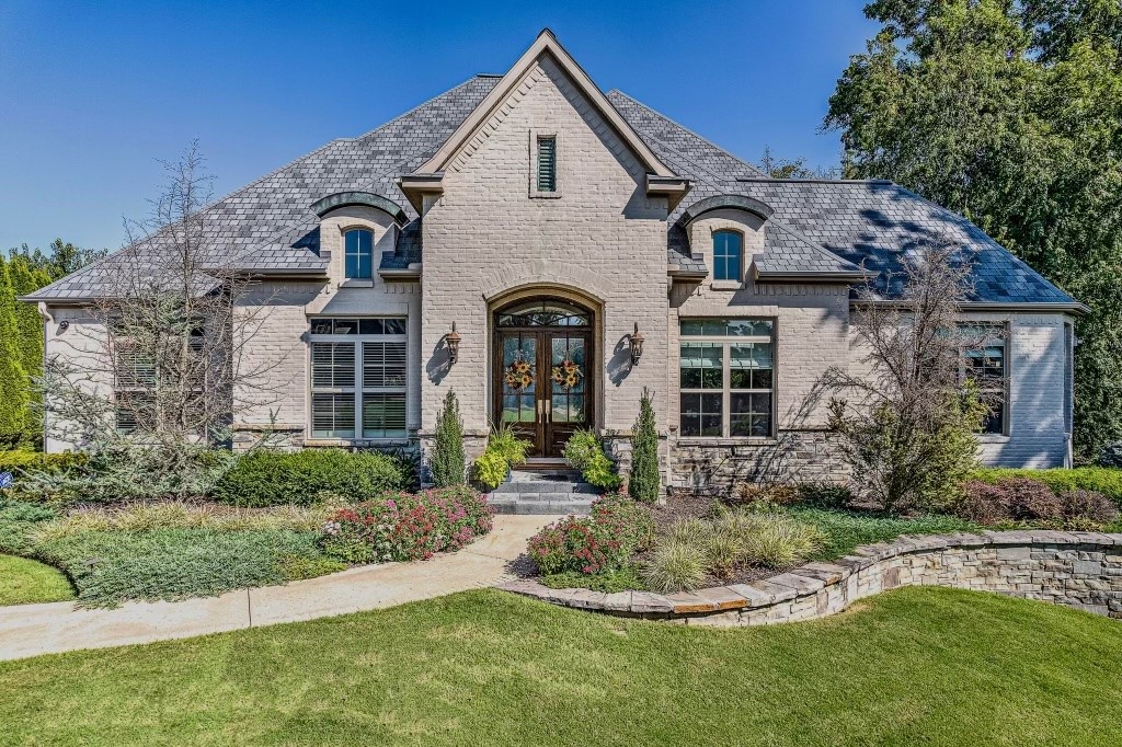 Discover unparalleled luxury in this stunning 5-bedroom, 8-bath estate home nestled on a sprawling 1-acre lot in the private, gated community of Pinnacle. Elegantly designed, this home boasts a grand entry, expansive living spaces, and exquisite finishes throughout. The chefās kitchen features marble countertops, a large island with prep sink, and top-of-the-line appliances including a Wolf gas range and Sub Zero refrigerator. The spacious master suite includes a spa-like en-suite and custom designed walk-in closet. Additional bedrooms offer private baths. After a long day on the golf course relax in the home theater to watch a movie or step outside to your personal paradise: a pristine saltwater pool, relaxing spa, and lush landscaping that creates an idyllic setting for relaxation and gatherings. The charming guest house ensures comfort for visitors with its own living area, full kitchen, and bath. This home combines sophistication and comfort, offering a perfect balance of luxury and privacy.