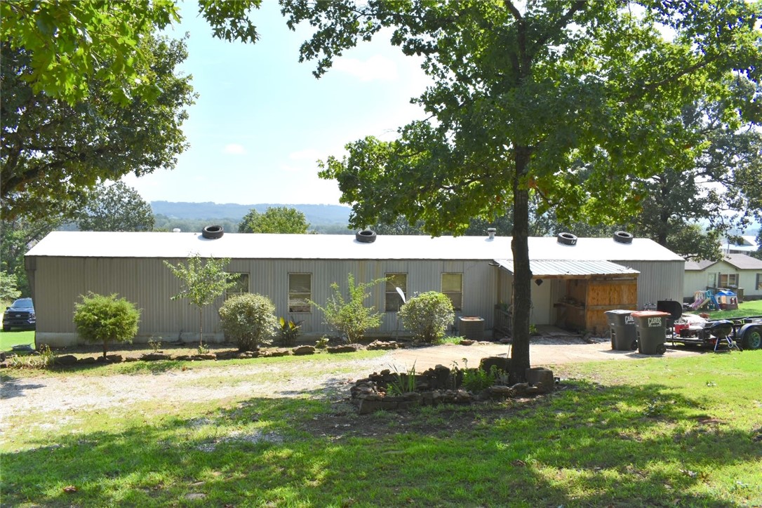 This 3-bedroom, 2-bathroom manufactured home offers an excellent investment opportunity or potentially a starter home. Situated on a spacious 0.70-acre lot with stunning views of the surrounding mountains, this property provides both privacy and potential. The home features a split floorplan, ensuring added privacy with the primary bedroom on one side and the secondary bedrooms on the other. Each bedroom is ample in size, offering comfortable living spaces. The open living area flows into the kitchen, making it easy to entertain or relax. Located in a convenient area, you'll have easy access to local amenities while enjoying the tranquility of the surrounding landscape. This property is perfect for those looking to invest or create a welcoming home with plenty of room to grow. In-house financing or cash only.