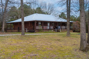 Gorgeous log home sits among the trees on a little over 8 acres M/L. The house sits at the back of the property and fronts CR 608. Great 40X50 shop with overhang for RV parking. About six acres is wooded. A circle driveway is in front of house. House is open concept with vaulted wood ceiling. Exterior walls are gorgeous wood. Basement is approx. 900 sq ft which consists of a 2 car garage and a place for extra storage. House has over 1200 sqft of wrap around porch. House was built in 2007. Updates include brand new HVAC system installed in early summer of 2021, new propane range only a couple of months old, and new washer and dryer, which convey. You must see this property to appreciate!! Exterior of house was stained end of 2021. Shop is 40X50 (20' is open shed.