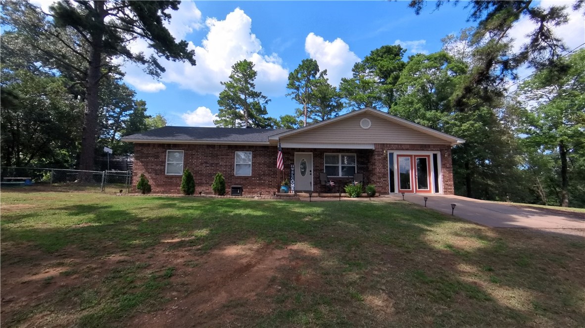 3 bedroom home with a bonus room on over an acre with a small shop!