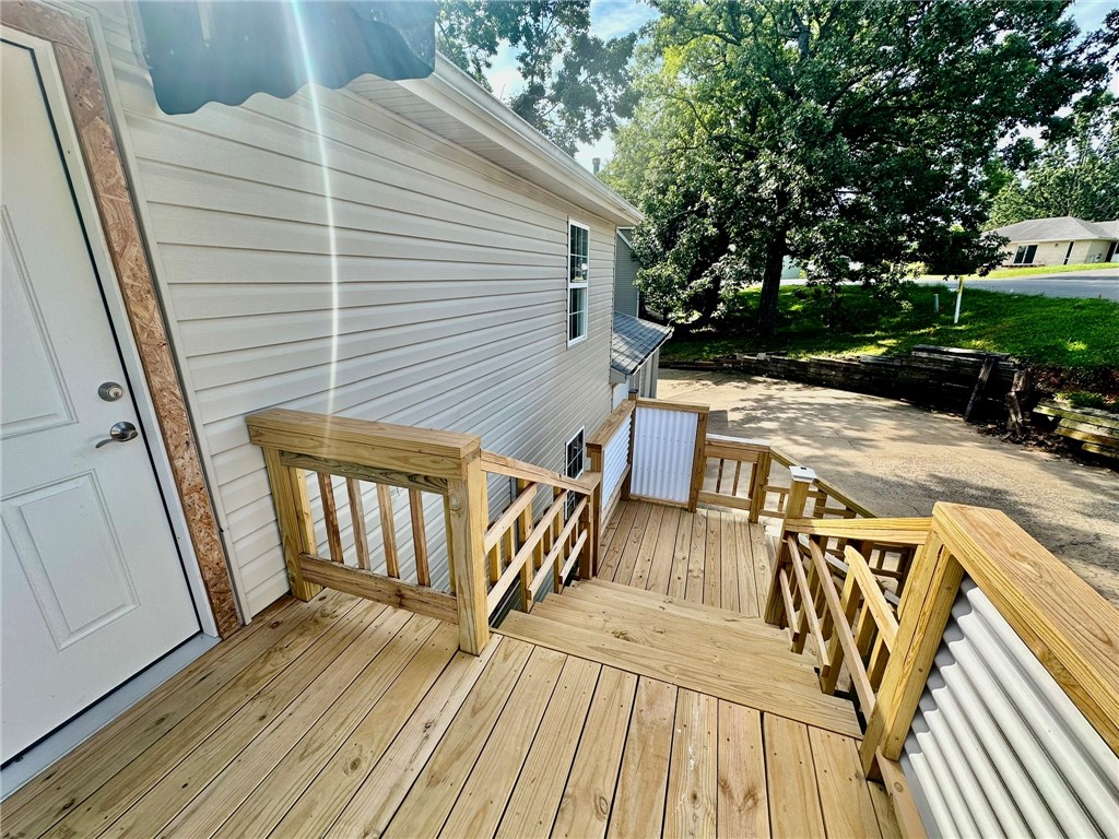 This spacious unit boasts granite counters, luxury vinyl floors, stainless appliances, fresh paint, new ceiling fans, and a large picture window. Enjoy peaceful Ozark views and seasonal lake views. Located just 3 minutes from Prairie Creek Marina, park, and golf course, and only 7 minutes to downtown Rogers. Includes 1-car garage, in a wooded subdivision. Lawn care included. Fireplace is decorative and not functional. Renters insurance required. *$250 non-refundable pet fee per pet.*