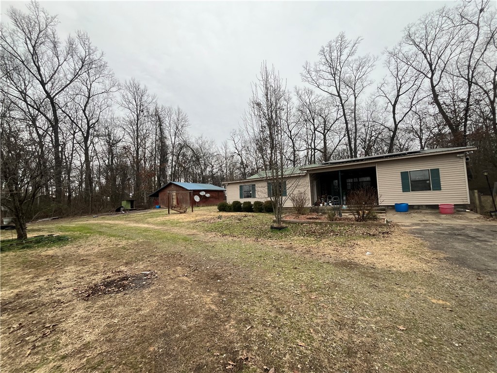 3 Bedroom/1.5 Bath Home PLUS an Extra Bonus Room that could be used as a 4th Bedroom or an office space (with another half bath), all on One Acre. This house also has a Large Den with a Fireplace and a Large Pantry off the Kitchen. Come Check it out!