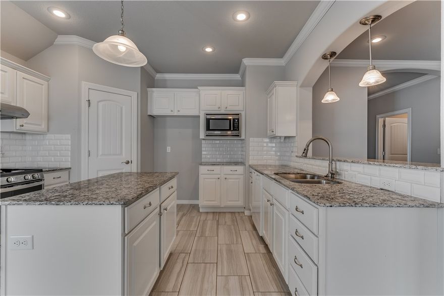 Welcome to 2905 S 4th St! The home is tucked in an established Rogers neighborhood close to everything you need perfect for your next home. This one-level, 3-bed, 2-bath home features a split floor plan with the primary tucked away, covered patio with private backyard, & a spacious living area with a gas fireplace. The kitchen includes granite counters, plenty of storage with it's own pantry. The primary suite offers double sink vanity, walk-in closet, soaking tub, & separate shower. Enjoy your covered back patio & spacious fenced in yard for easy outdoor living, perfect for pets. All this within 10 minutes to I-49, Pinnacle Hills Promenade, Walmart Supercenter, Topgolf, Rogers Aquatic Center, Fitness One, & endless dining options. Move-in ready & in a location that puts it all at your doorstep.