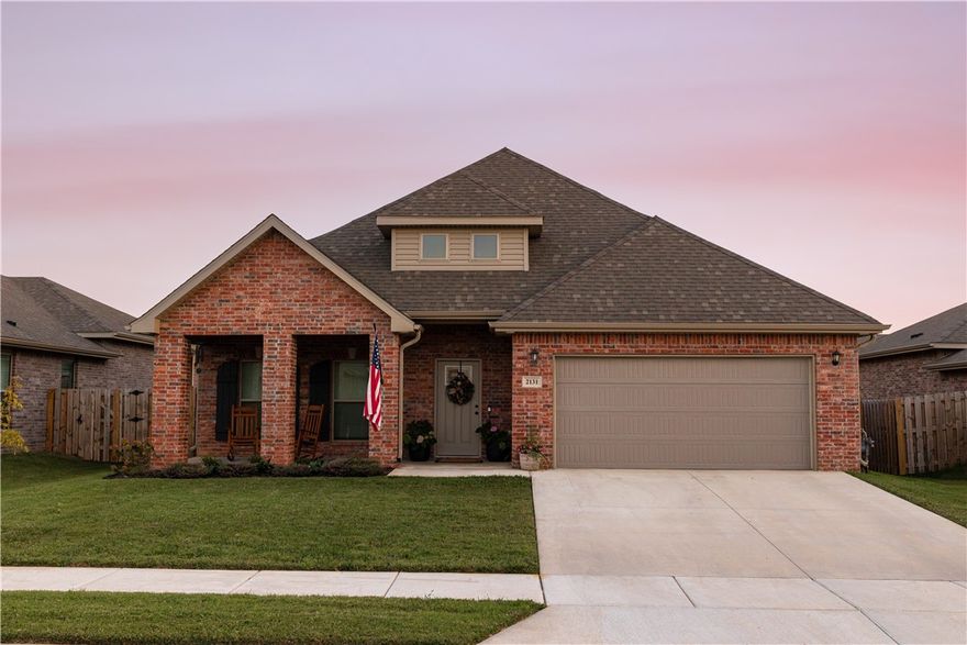 Welcome home to your beautifully finished and thoughtfully designed floorplan with space for the whole family to spread out. The open and airy first floor features a large living room beaming with natural light and an elegant electric fireplace. The living room flows into the open dining area and conveniently located half bath. The spacious kitchen has stylish black stainless steel appliances and an oversized walk-in pantry for all of your storage needs. The primary bedroom is located on the first floor with an ensuite bath with double vanities, a large soaking tub and walk-in shower. The primary closet flows effortlessly into the laundry room for ultimate accessibility & convenience. The 2nd floor has 2 additional bedrooms, a full bathroom and a flex space ideal for a play area, side hustle or office needs. The fully fenced backyard boasts a covered patio with a 10'x20' extension. Garage is wired for 240V EV chargers. Located less than 10 miles from downtown Bentonville, XNA and WM HQ.