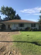 Solid house, lived in by single lady, h/a about 10 years old, original hardwood floors, some have had carpet over at some time, kitchen is age of house, There is an alley behind house that allows access to back yard from back in event someone wanted to add a shop.