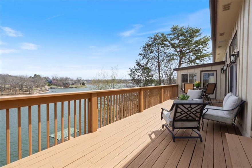 This contemporary Lake FRONT home is the epitome of living the Lake Life! Situated near the main channel Loch Lomand, offering panoramic views of tranquil waters and surrounding natural beauty. Thoughtfully designed and built, this property offers open floorplan, 3 Beds, large home office, 2 living rms, screened porches, open decks integrating interior and exterior living. Floor to ceiling windows throughout the home capture stunning vistas of the lake filling every room in natural light. Updated cooks kitchen has SS vented gas range and more for today’s lifestyles. The large formal dining room overlooking the lake provides the perfect setting for hosting gatherings and intimate meals with family and friends. Solid wood floors and massive stone fireplace have a timeless charm. Main level primary suite with gorgeous new spa styled bath. Walk out basement. Rock landscape. Staired walk to Private Dock, Swim Deck, Concrete Seawall and Deck. Many updates. Minutes away from Golf, Hiking, Dining and Shopping options.