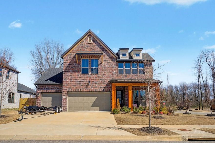 Stunning one owner home with great curb appeal on a corner lot in sought after Magnolia Park.  Step into this high-end home with tons of upgrades, where style meets convenience! The heart of the home features an open kitchen, dining, & living and is filled with natural light.  The kitchen boasts a large island, apron sink, sleek quartz countertops, gas cooktop, & stainless steel oven, dishwasher, refrigerator, & microwave. An additional bedroom/office is also in the downstairs area along with a powder room.  Upstairs has an additional living area/playroom, two bedrooms & a full bathroom with double sinks. The oversized covered back porch with additional wood/gas fireplace looks over a large fenced yard & serves as a bonus retreat area, providing plenty of seating for family & friends to enjoy.  There is also a 3 car garage (with EV charger) for all your bikes, tools & mower!  The home is perfectly situated near schools, parks, & trails with easy access to I-49.