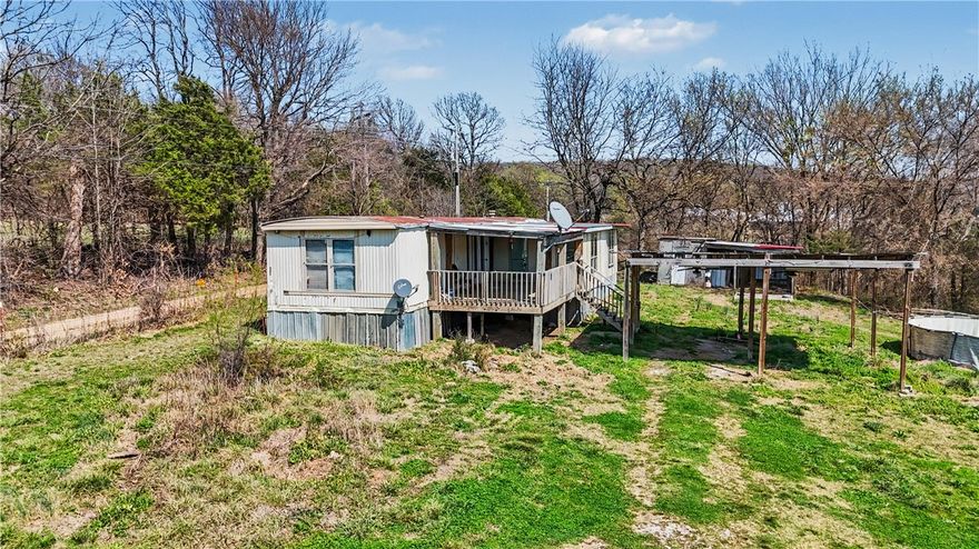 Peaceful country living on approximately 3.84 acres in Summers. This property offers a fully fenced lot with plenty of space for animals, outdoor activities, or future improvements. The existing manufactured home provides a great opportunity for a primary residence, rental, or investment.

Recent updates includes a septic tank, a newer water heaterand A/C condenser unit for added comfort and efficiency. The property also features a 2-car carport for covered parking.

Enjoy the privacy and tranquility of rural living while still being within a reasonable drive to nearby towns. If you're looking for a quiet and peaceful place with land and potential, this property is worth a look.