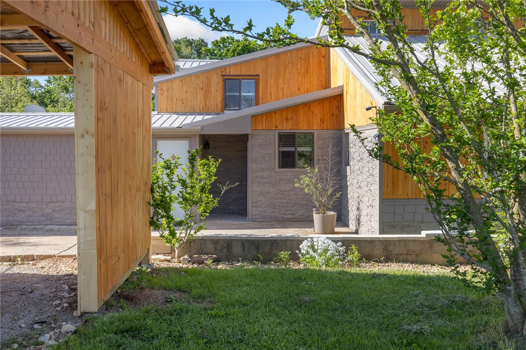 This multi-family home boast a spacious layout with 3 inviting BR & 2 BA in the main house, & an add'l mother-in-law guest house with 2 BR and 1 BA (complete with all furnishings). 4 12K BTU mini-splits. Ideal for accommodating extended family or generating rental income as an AirBNB (rental statements attached). Situated in peaceful rural scenery, this .44 ac lot is just 15 minutes from Harrison and in the Bergman School District. Per seller, there's 2535 sf of living space with an additional 200 sf storm shelter, 100 sf each greenhouse/storage building w/power and a small tool shed for lawn equipment. The 2 car carport w/power has 450 sf of dry storage space above & add'l 4 car for driveway parking. Multiple decks & patios offer extra outdoor living space. The property has its own well (well and pressure tank <3 yrs) as well as rural water available. Fire pit and hot tub with 4 jets. Cedar & Hardie plank siding. Metal roof. Built in 1985, roof has 2 1/8" pine tongue & groove decking! Electric control box <3 yrs