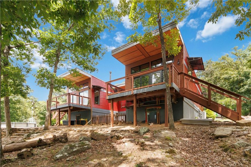 Escape to 27 acres of privacy and natural beauty at 18544 Bug Scuffle Road! This custom 4 bed, 3 bath offers over 3,000 heated and cooled square feet with granite countertops, a spa-like primary suite, and a full finished basement with a large bonus room. A mix of woods and open land offers the perfect locations for hunting, fishing, and just enjoying the beautiful scenery. Tucked away in the hills just minutes from Devil's Den state park, while a short distance from all of Northwest Arkansas amenities.