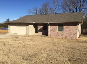 3 Bedroom and 2 Bath home on a Corner Lot. Property is located in a small neighborhood outside of town. Home features a large open living area with a split bedroom design. Lots of room for outside entertainment with a cover deck and fenced backyard for pets