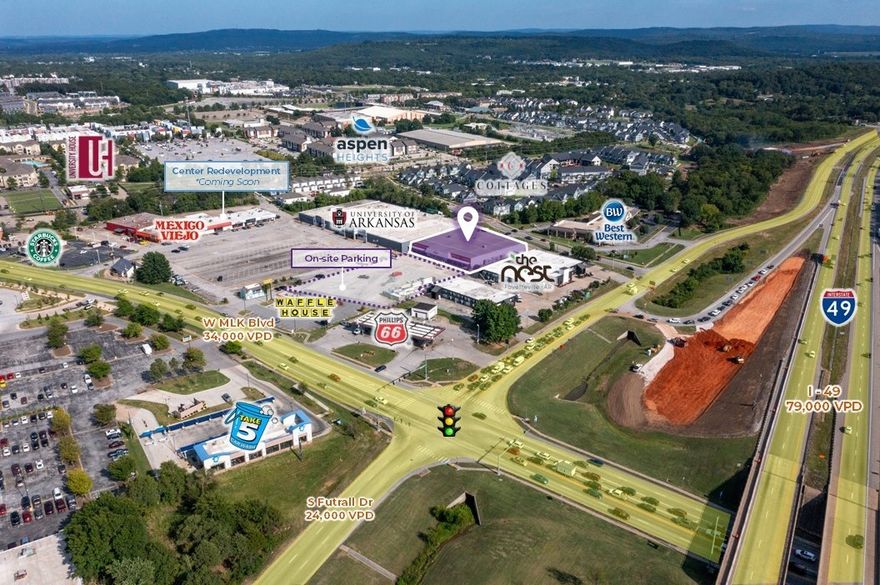 The space can be subdivided.  Rear loading dock and fenced yard area.  Prime retail location immediately off the I-49 exit at MLK Blvd.  One of the most heavily trafficked areas in the Fayetteville market.  0.7 miles from the University of Arkansas campus.  10,000+ students live within 1 miles of the property.