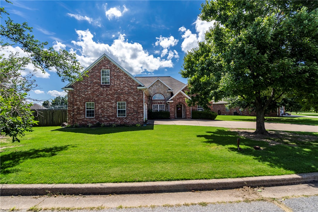 This beautifully cared for home in the desired Ravenwood subdivision can be yours! Home is located on .36 acres with landscaped yard and fenced back yard. This all brick home has 3 BR 2 BA and a bonus room up stairs. Home interior walls and ceiling painted in last 2 years. Complete with dining room and eat-in kitchen, this 2,508 square foot home offers gracious living spaces. Crown molding and gorgeous columns and window trim add to the charm in this home. Floors are maple wood, tile in kitchen and bathrooms, carpet in bedrooms. The covered patio and outdoor fire place invites you outside to enjoy the spacious backyard. Walk out your back gate to the pool, play area and tennis courts. A/C is serviced annually. Dishwasher 2 yrs old. Fridge in garage can convey.