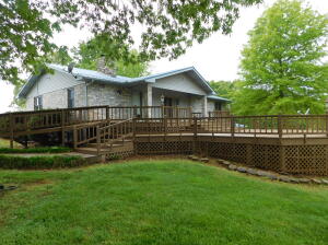 Unique opportunity with this 3894 Sq Ft, 5BR, 3Bath Brick home (fully finished basement) on 20 acres located in the Valley Springs School District. Features of the home include hardwood floor; large 34'x30' front deck (with ramp); 30'x14' back deck; Generac back up generator; large great room in the basement (with wet bar); basement walkout to a large 2 car attached carport; abundance of closets, storage & built-ins. Built-in gun safe or saferoom in the basement. New HAVAC installed in 2017. Outside features include a metal 30'x30' shop (concrete floor) with 30'x16' side shed (with a dog kennel); garden spot and large 1000' owned propane tank. Property (with large trees) lays good (multiple other building locations) with paved county road frontage.