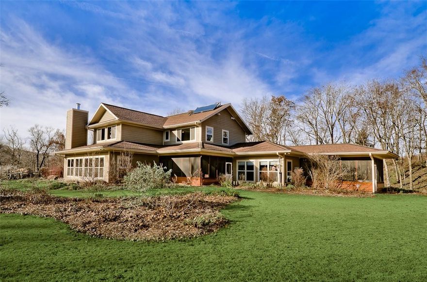 Beautiful estate on 23+acres just 10 minutes from downtown Fayetteville.  Stitt Energy Systems built - super efficient, comfortable and private. Dramatic passive solar design with solar electric PV system, solar hot water, insulated concrete form foundations, "ice house roof" and six" walls. Fantastic, open floor plan with tons of natural light, large kitchen, dream mud room, study, massive library, 3 screened porches, elevator, breathtaking themed gardens and more.  Please view tour and see attachments.