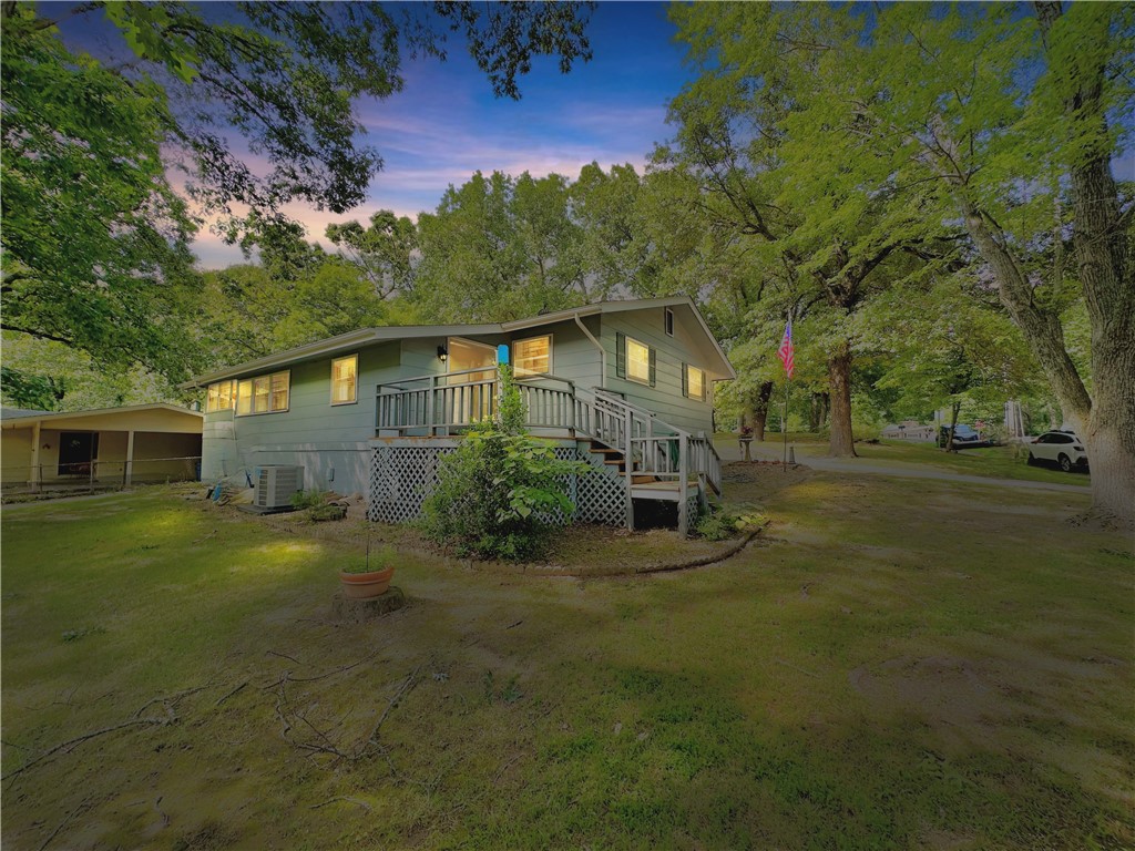 Instant equity!!! Appraised for $250k. Near Bike trails & lakes. Cozy home nestled in the tranquil corner of Bella Vista. Pre-inspected=peace of mind. Delight in the spacious lot with beautiful mature trees, with ample room for landscaping and outdoor entertainment. Enjoy a covered, screened-in patio and a small deck off the sunroom/office (could be used as 3rd bedroom) for outdoor relaxation. Complete with single car garage and workshop! The recently replaced roof, gutters, & HVAC system with new duct work as well Newer water heater-comfort and efficiency! Located in Bella Vista, known for its scenic landscapes and welcoming community, this home provides easy access to I49, amenities, shopping, dining, parks, and recreation. Whether you're an investor or homeowner, don't miss out on a lucrative opportunity in Bella Vista's thriving real estate market. This property is just a few minutes from Lake Windsor, Lake Ann and Lake Avalon! Schedule a showing today!