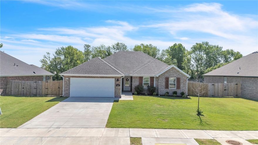 This inviting Springdale home sits in a quiet, well-kept neighborhood and offers a bright, open layout designed for both everyday living and entertaining. The spacious living area features tall ceilings and a cozy fireplace, flowing seamlessly into the dining space and kitchen.

Enjoy a well-appointed kitchen with ample cabinet storage, stainless steel appliances, and a breakfast bar—perfect for casual meals or morning coffee. The primary suite is a relaxing retreat with a large walk-in closet and a spa-like bath featuring dual vanities, a soaking tub, and separate shower.

Two additional bedrooms offer flexibility for guests, family, or a home office. Step outside to a private, fenced backyard with a covered patio—ideal for relaxing, pets, or entertaining. Recent upgrades include a new roof and gutters for added peace of mind.

Ideally located just minutes from schools, shopping, dining, and I-49, this home combines peaceful neighborhood charm with everyday convenience.