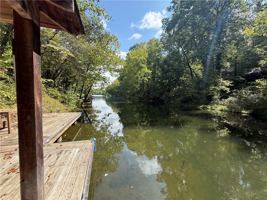 New Price: $575,000 — Incredible Lake Windsor Value!
Brand-new carpet and pad just installed throughout! This rare lakefront opportunity includes a private dock and a newer tram for effortless access to beautiful Lake Windsor. Tucked into a quiet cove on a wooded 0.82-acre lot, this 4-bedroom, 3-bath home offers over 2,800 sq. ft. of space with great bones, abundant natural light, and tons of potential.

Whether you’re envisioning a personal lake retreat or an investment property, this home is priced well below renovated comparables—making it one of the best values on Lake Windsor. Enjoy the peaceful setting, generous layout, and hard-to-find waterfront features. With the right updates, this could be a showplace. Don’t miss your chance to secure premium lakefront living at an exceptional price.