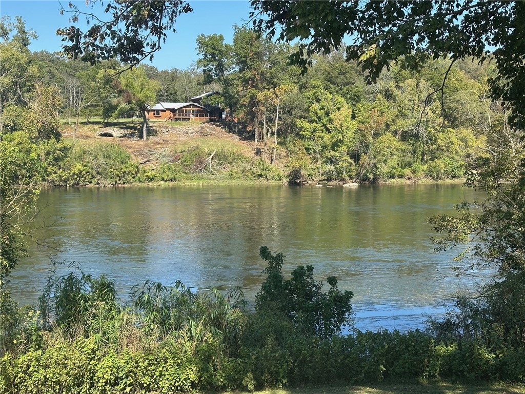 Serene 5-Acre m/l, Wooded Retreat with River Frontage! Experience the ultimate in privacy with this stunning 5-acre m/l property featuring 200feet of river frontage, nestled in the White River Valley Subdivision. Located upriver from the Buffalo River, this parcel offers paved road access for your convenience. This land comes with a 3-bedroom perk test, making it ready for your dream home or getaway. Enjoy the benefits of the community with HOA dues of just $300 per year, granting you access to two private boat ramps and clubhouse privileges. Donāt miss the chance to build your ideal retreat in this beautiful, natural setting!